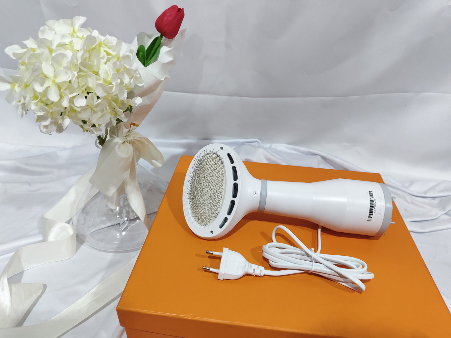 Dadypet Pet Hair Dryer Grooming Brush is a 2-in-1 dog and cat grooming tool