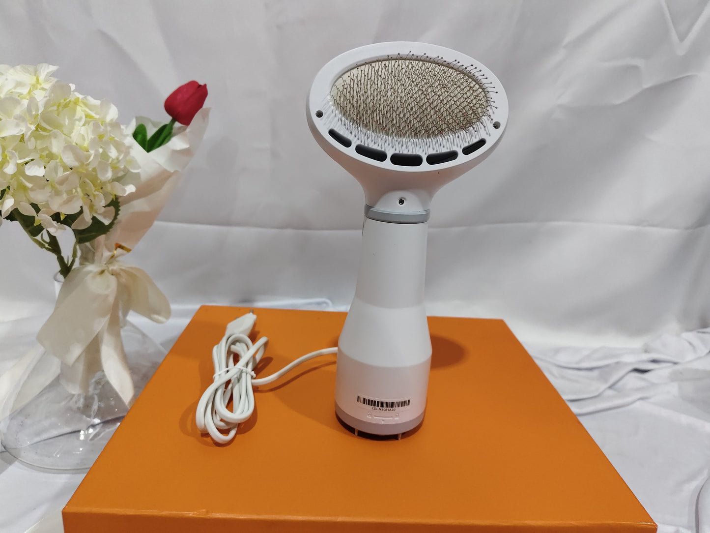 Dadypet Pet Hair Dryer Grooming Brush is a 2-in-1 dog and cat grooming tool